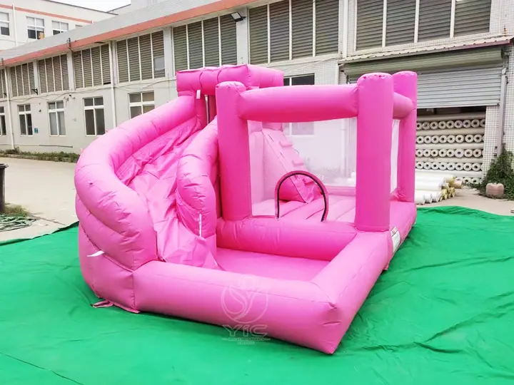 pink bounce house with slide