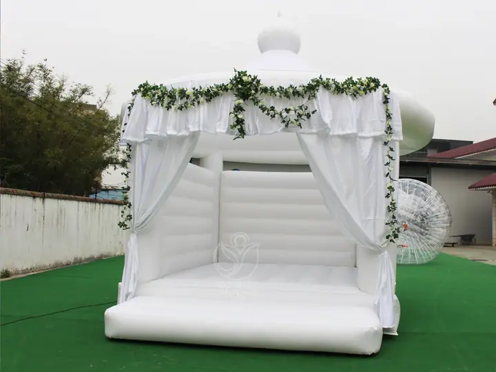 white wedding bounce house