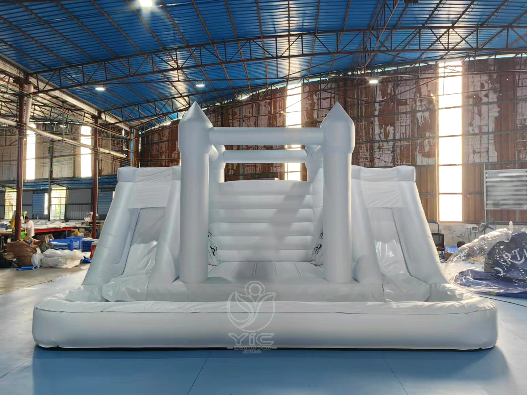 White bounce house with double slide